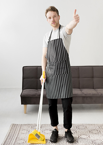 man-with-broom-showing-ok-sign